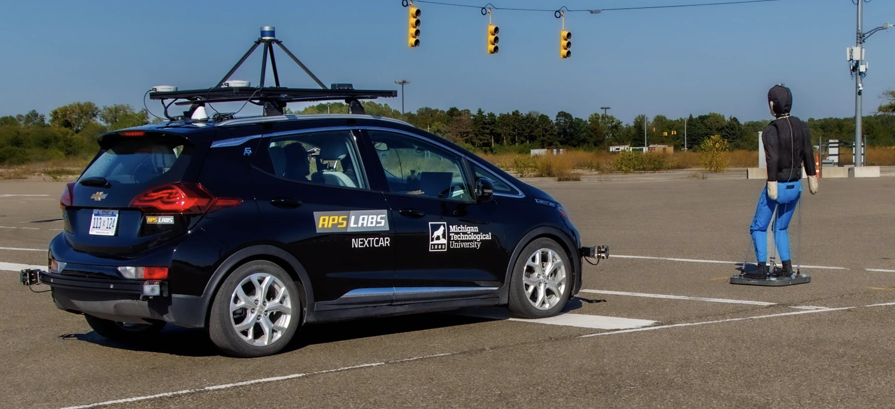 Michigan Tech APS LABS research vehicle approaching a pedestrian test target at ACM