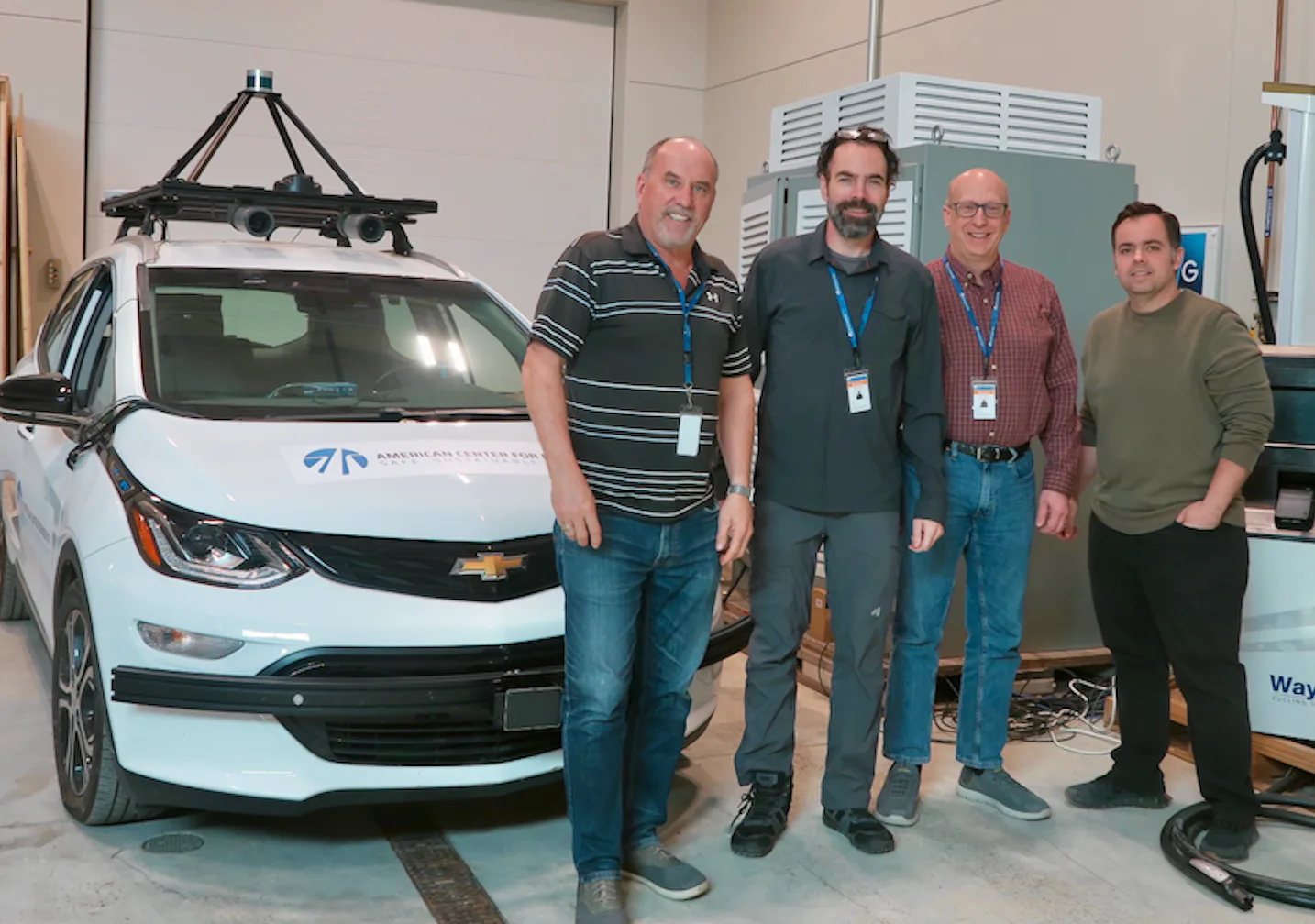 EcoG and ACM team members with an ACM test vehicle at the EV Basecamp — pictured from left to right: Bob Skinner, Kevin Ferron, Max Dorflinger, Don Florica