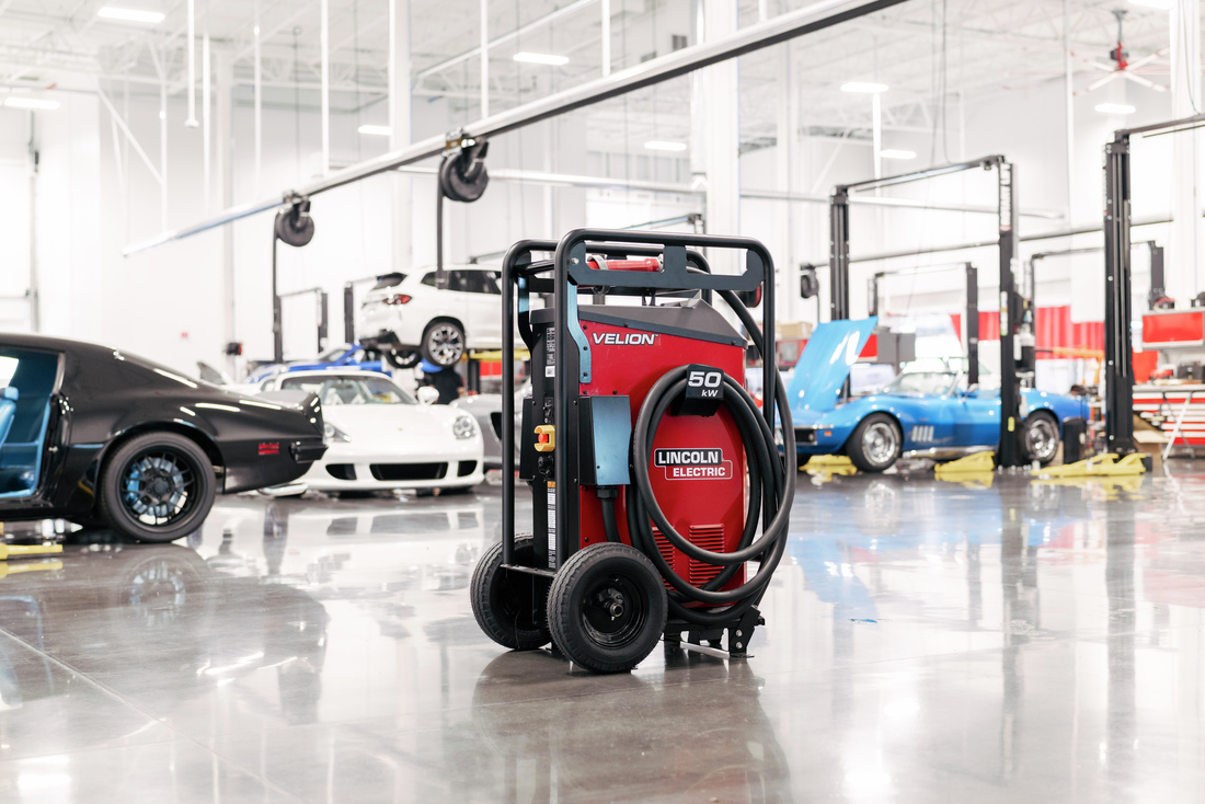Lincoln Electric’s Velion® 50 kW mobile DC fast charger inside a vehicle workshop